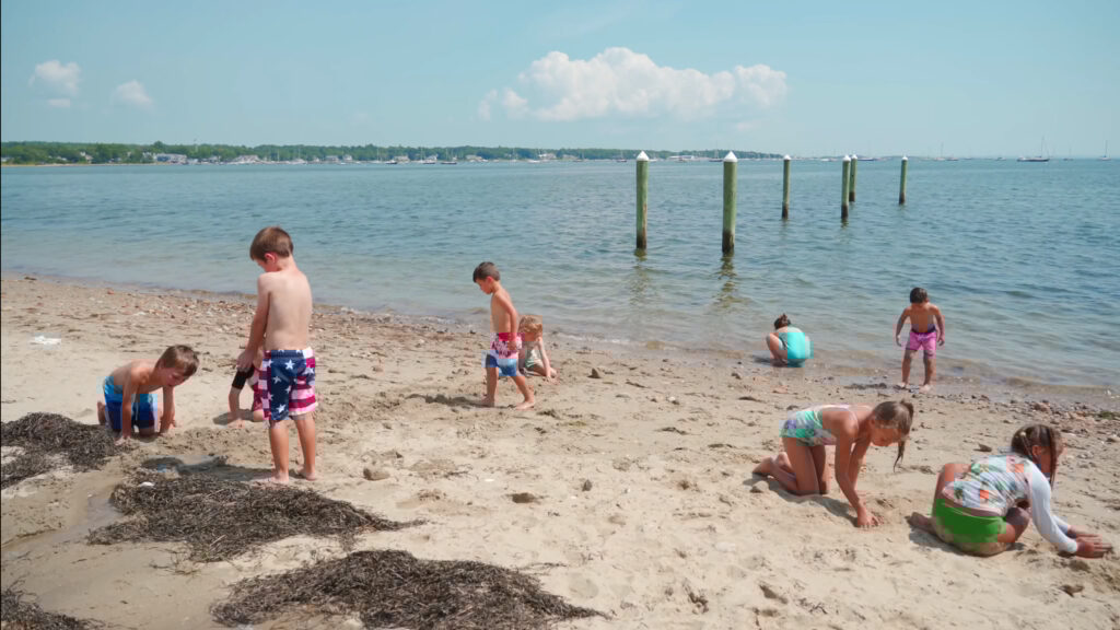 Children playing at the beach near the Mattapoisett YMCA