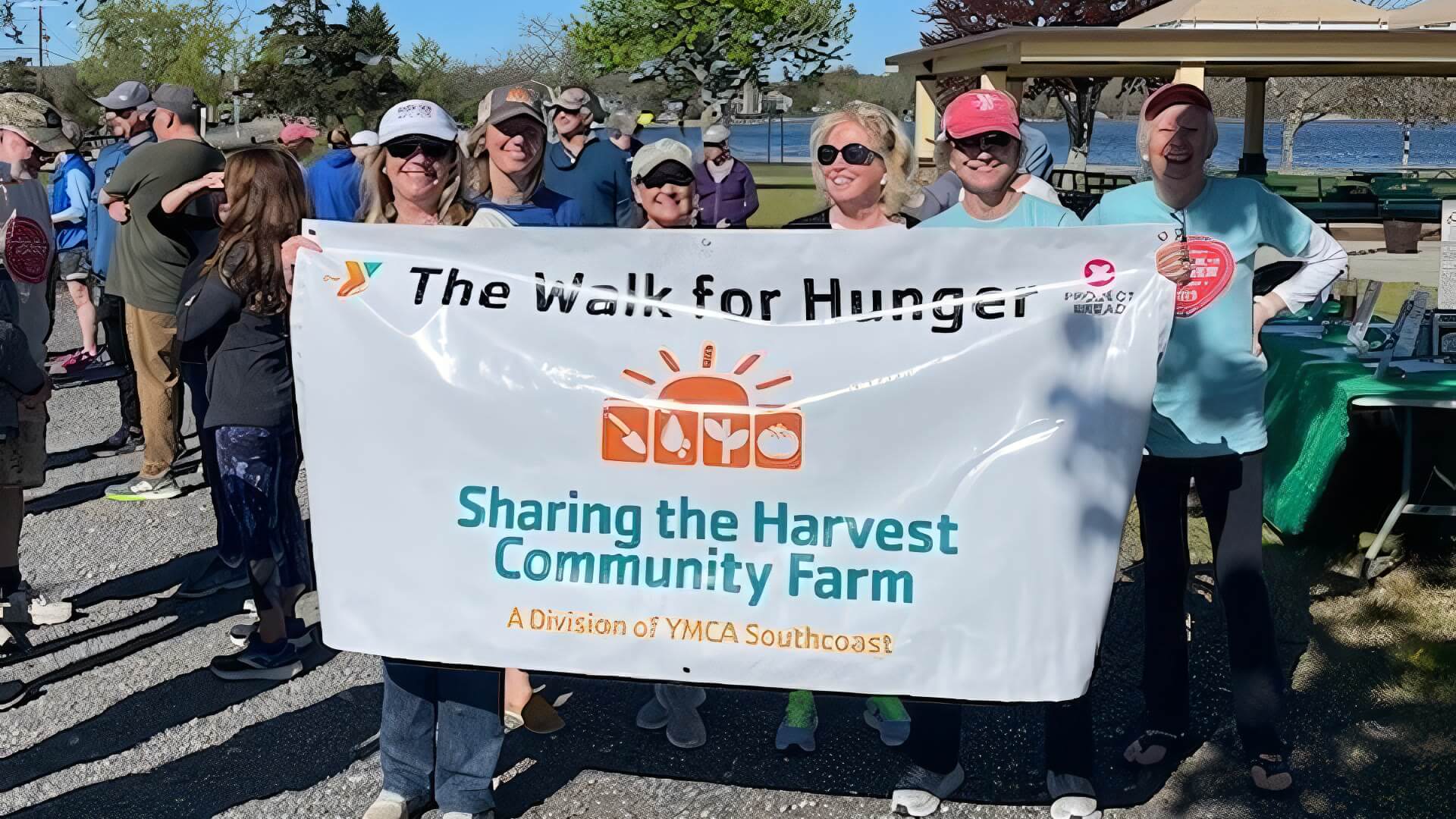 WFH picture-crop-optimized Walk for Hunger participants holding a sign for YMCA Southcoast